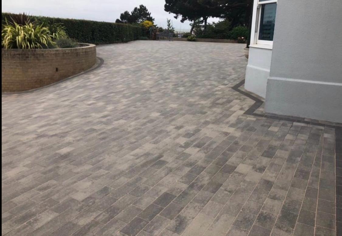 Wide block paving driveway around a house