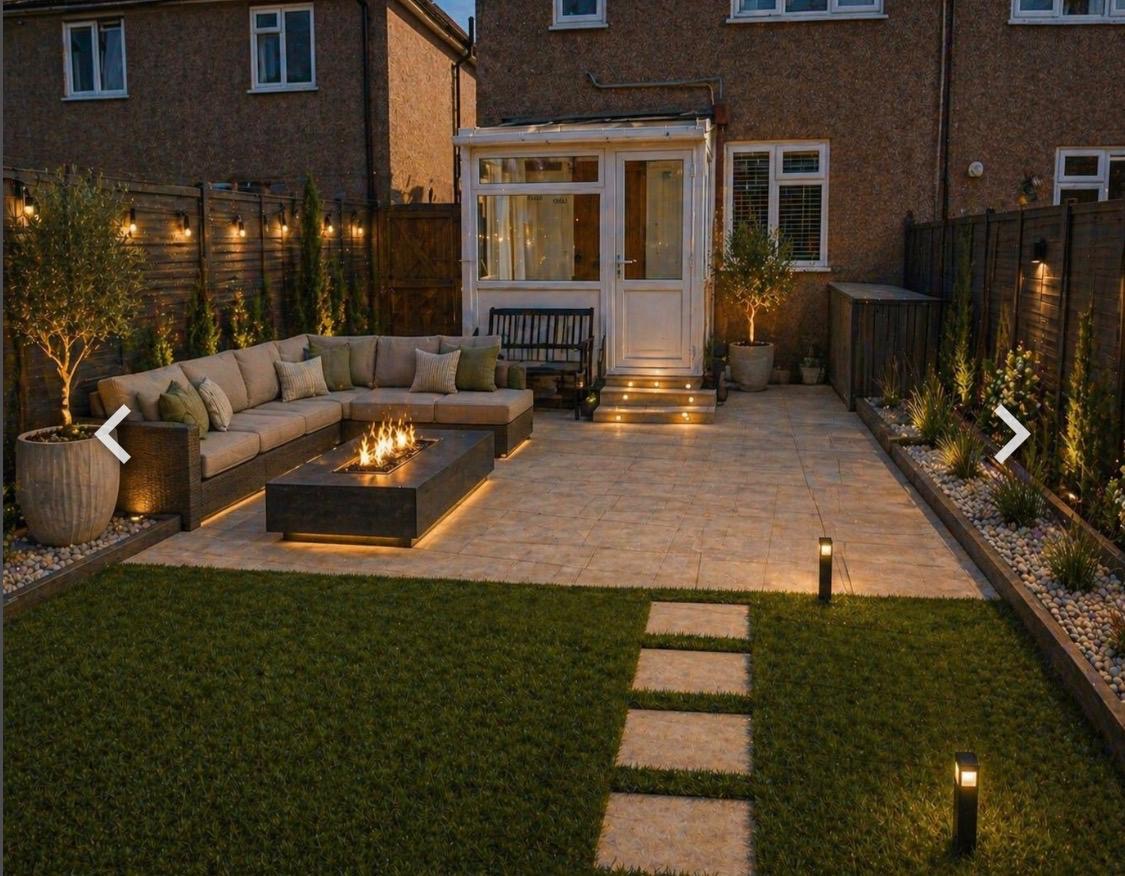 Evening garden seating area with patio lighting and fire table