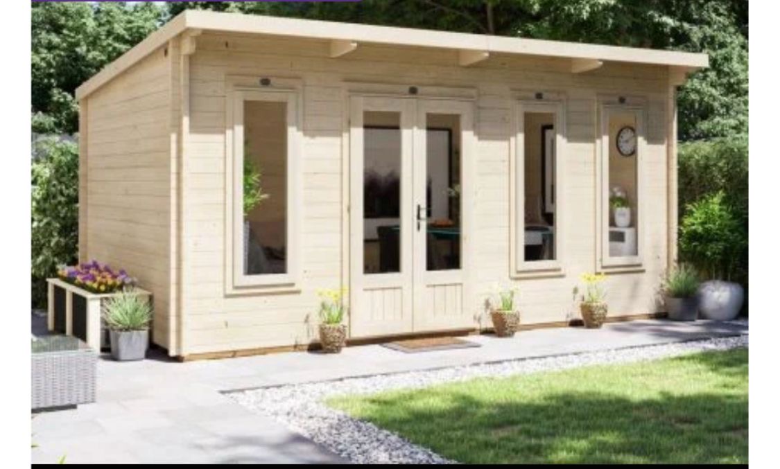 Timber garden room with double doors and patio frontage
