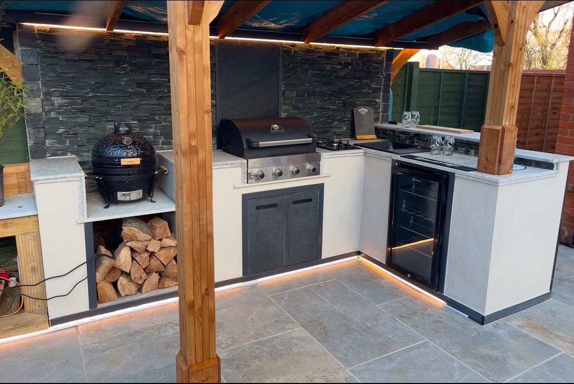 Covered outdoor kitchen with integrated lighting