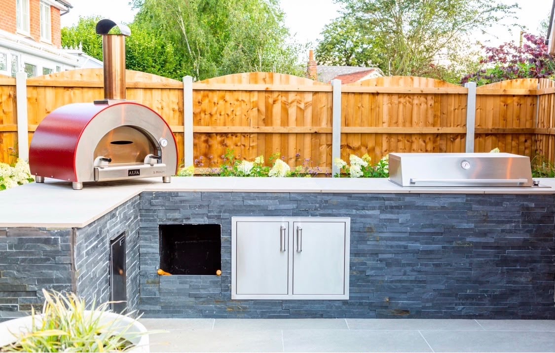Outdoor kitchen with pizza oven and built-in barbecue