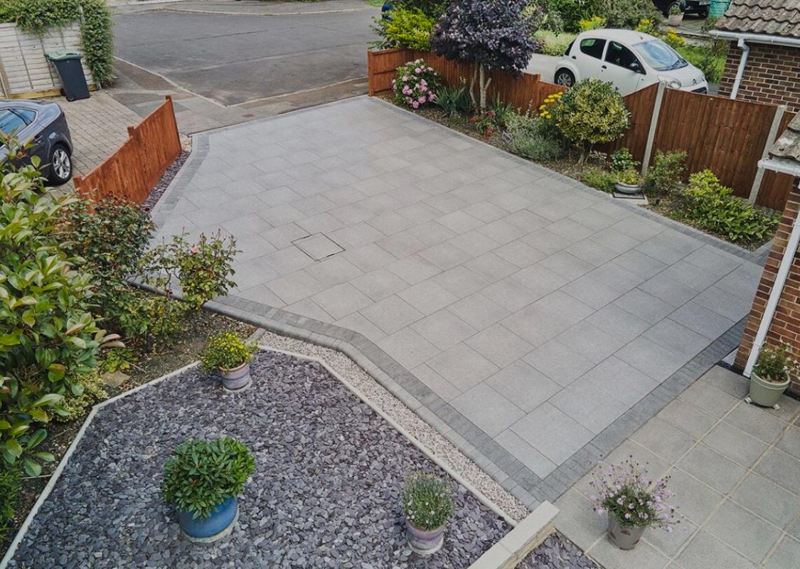 Aerial view of a porcelain driveway and front garden