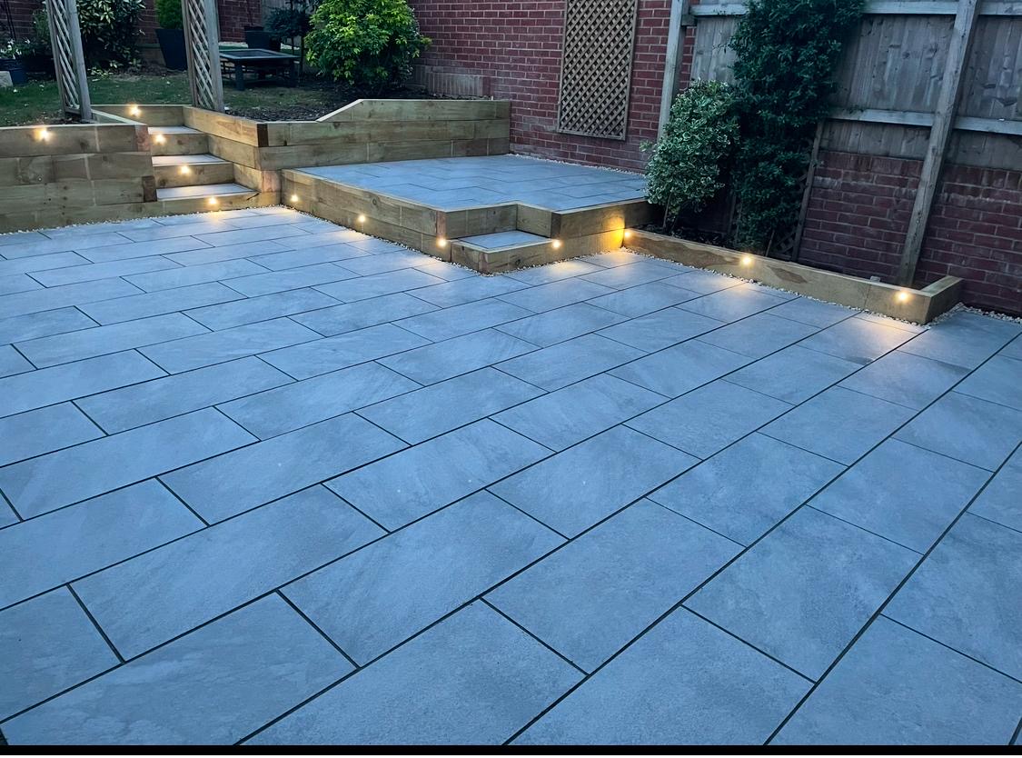 Porcelain patio with timber sleepers and integrated lighting